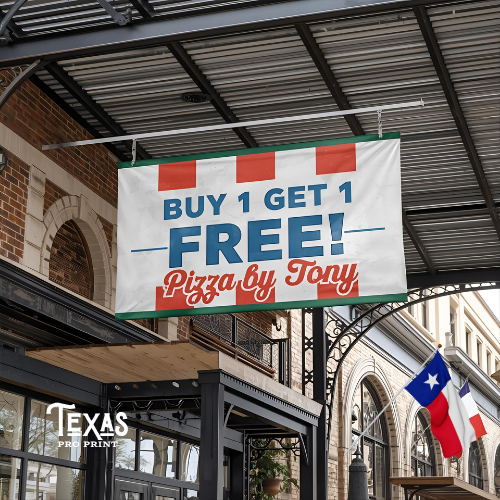 Promotional banner for 'Buy 1 Get 1 Free' offer from Pizza by Tony hanging outside a building with a Texas flag in the background.